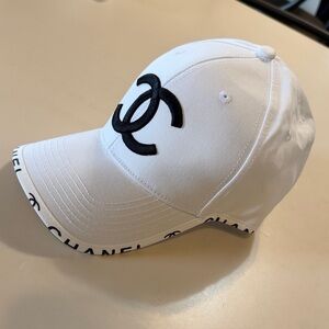 CHANEL White Hat with Black Emblem